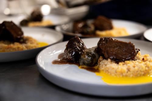 a plate of food with brownies on a table at Boutiquehotel DAS ZEITWERT in Deutschlandsberg