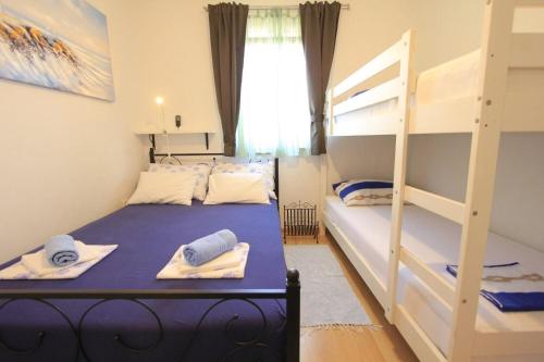 Posteľ alebo postele v izbe v ubytovaní House Mirta
