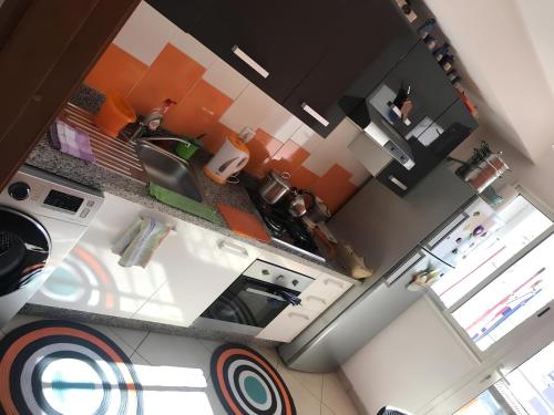 an overhead view of a kitchen with a stove and a sink at Appartement ,Tram Parking and wifi gratui in Casablanca