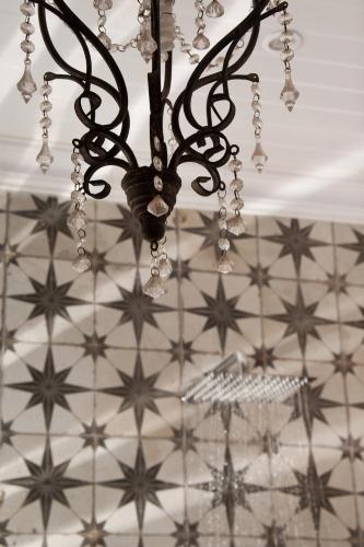 a chandelier hanging from a ceiling with stars at Dalmore Guest Farm in Bergville