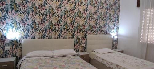 Letto o letti in una camera di The Caponi Bros