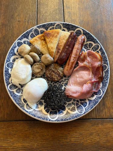 a plate of food with different types of food on a table at An Caislean incorporating Corratavey in Ballycastle