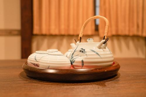 a cake sitting on top of a wooden table at 都電屋 TodenHotel in Tokyo