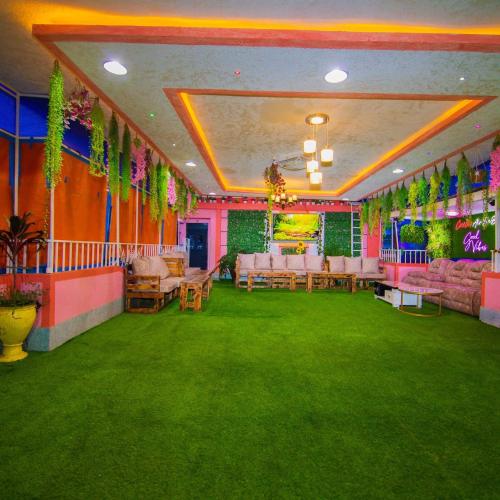 a room with pink and green carpet and tables at Exclusive Rooftop Retreat in Nairobi