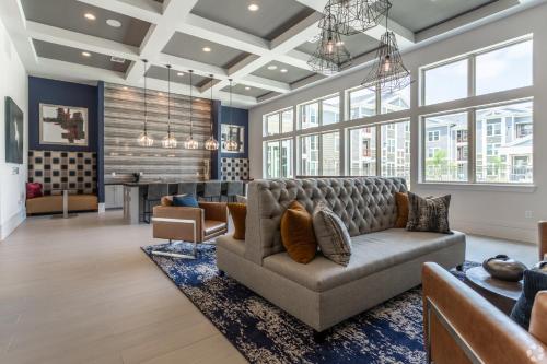 a living room with a couch and a table at Cullen 8206 I New Construction 1bd Apt I Gated in Houston