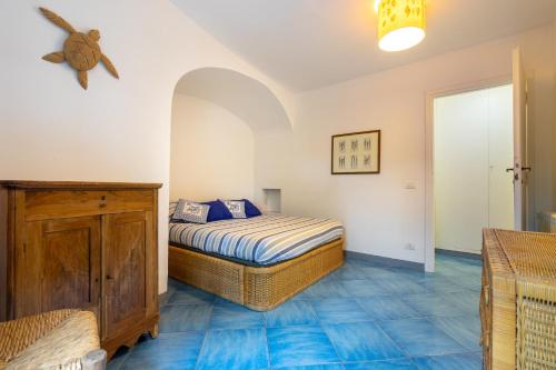 a bedroom with a bed in a room at Dimora Punta Rossa in San Felice Circeo