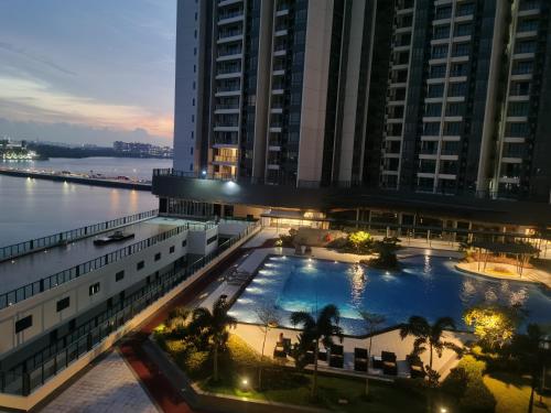 an overhead view of a building with a large swimming pool at TheBess Hotel Tokyo is located adjacent to Singapore and offers a sea viewIt is a family business smart room with the sea view of Princess Bay富力公主湾 in Johor Bahru
