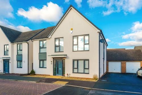 an image of a house with a garage at Hasting's House by YourStays - 3 Bedroom House in Stoke-on-Trent in Stoke on Trent
