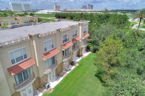 an aerial view of a building with a yard at Vista Cay Resort, Next To Universal #821 in Orlando