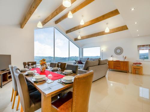 a dining room and living room with a table and chairs at Hen House View 1 - Uk41552 in Crawshaw Booth