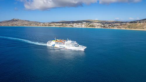 a cruise ship in the water with a beach at Casa Areia Dourada by An Island Apart in Porto Santo