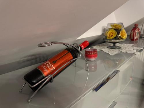 a glass table with a bottle on top of it at Apartament Mariola in Gdańsk