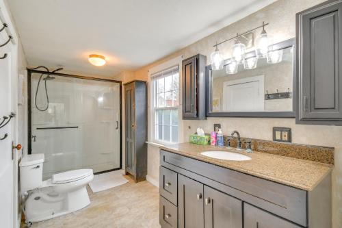 a bathroom with a toilet and a sink and a shower at 5 Mi to Lake Ontario Mexico Home with Seasonal Pool in Mexico