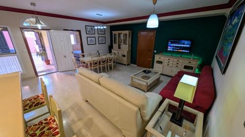 a living room with a couch and a table at Viña Home in Torre del Mar