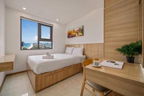 Giường trong phòng chung tại Muong Thanh Luxury Apartment Seaview