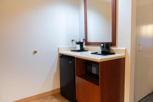a bathroom with a sink and a mirror at La Quinta by Wyndham Bannockburn-Deerfield in Bannockburn