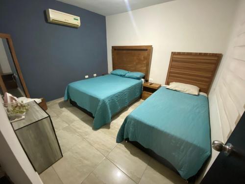 Ένα ή περισσότερα κρεβάτια σε δωμάτιο στο Departamento Piso 2