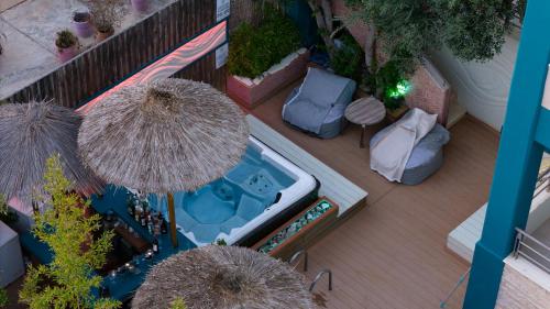 an overhead view of a patio with a swimming pool at Sun George in Finikounta