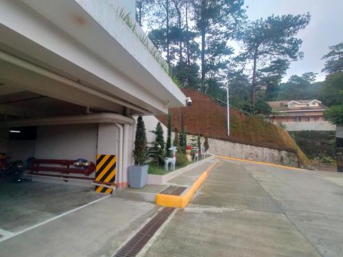 an empty parking lot next to a highway at Northern Vacation Homes - Selendra in Baguio