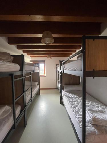 a room with a bunch of bunk beds at Olabe in Ea