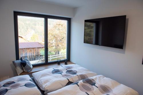 Ένα ή περισσότερα κρεβάτια σε δωμάτιο στο Appartement Herzmoar