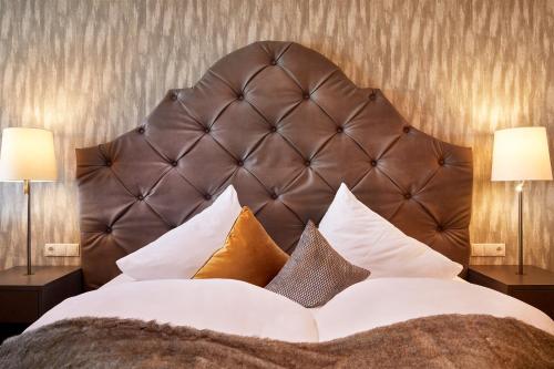 Ένα ή περισσότερα κρεβάτια σε δωμάτιο στο Vitalpina Hotel Magdalenahof