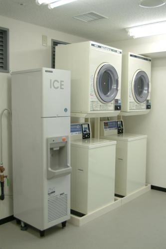 a laboratory with two machines on display in a room at Hotel IL Cuore Namba in Osaka