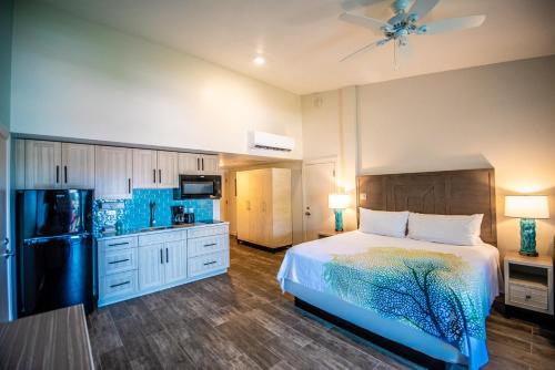 a large bedroom with a bed and a kitchen at Hilltop Villas at Bluebeard's Castle in Charlotte Amalie