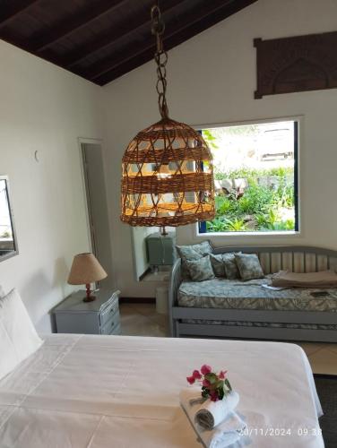 Katil atau katil-katil dalam bilik di Vila da Sol Itaipava casas e estúdios