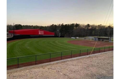 a baseball field with a red pavilion and a baseball field at 7th Heaven in Mena