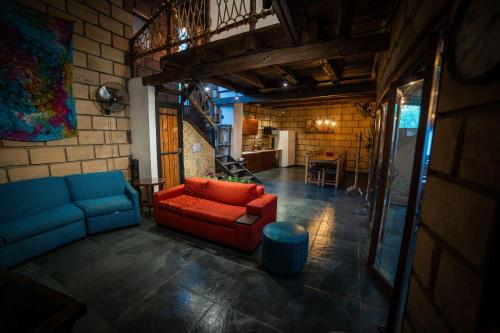 a living room with a couch and a table at Tierra Cielo y SoLuna - Cabaña Casona in Santiago