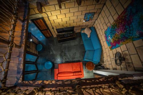 an overhead view of a living room with an orange couch at Tierra Cielo y SoLuna - Cabaña Casona in Santiago