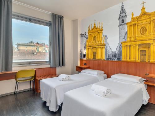 Postel nebo postele na pokoji v ubytování B&B Hotel Torino President