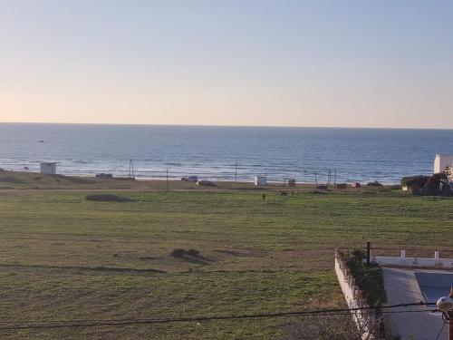 a view of the ocean from a house at La luna de briech in Asilah