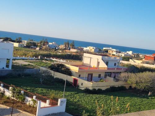 a view of a town from a building at La luna de briech in Asilah