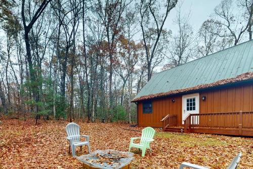 two chairs and a table in front of a cabin at Little Cub in Blue Ridge