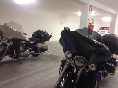 a couple of motorcycles parked in a garage at Residence La Nave in Senigallia