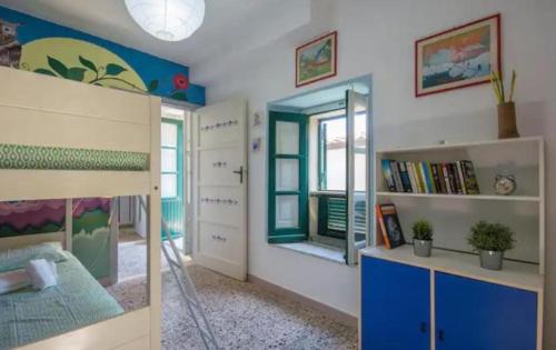 a bedroom with a bunk bed and a mirror at La Timpa house in Satriano