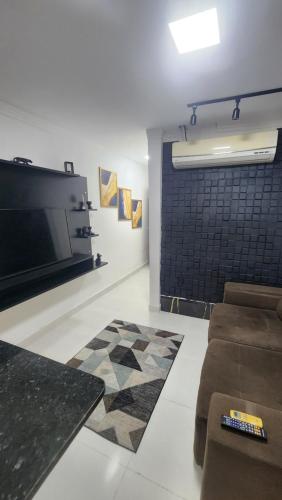TV a/nebo společenská místnost v ubytování Loft completo com area de lazer piscina e churrsqueira