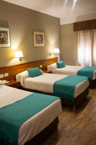 Ένα ή περισσότερα κρεβάτια σε δωμάτιο στο Hotel Centro