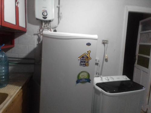 a refrigerator in a kitchen with stickers on it at ادفو35 كامب شيزار دور ثالث in Alexandria