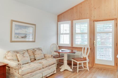 a living room with a couch and a table at Courtyard Villas On Silver Lake in Ocracoke