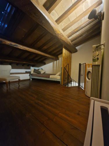 a living room with a couch and a bed at Piazza Duomo casa vacanze in Sutri
