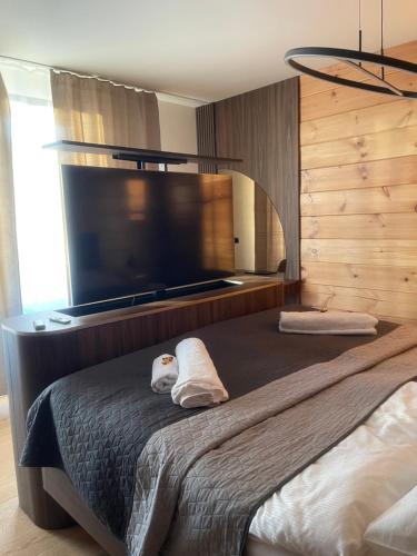 Ένα ή περισσότερα κρεβάτια σε δωμάτιο στο LUXY Apartment