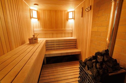 a wooden sauna with a bench in the middle at Ashtarak Venues in Ashtarak