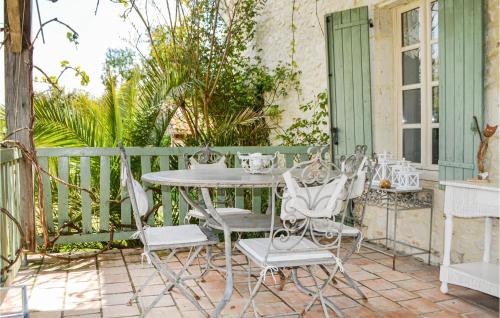 a table and chairs sitting on a patio at Awesome Home In Montaut With Wifi in Montaut