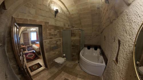 a bathroom with a sink and a toilet and a tub at Timur inn Cappadocia in Goreme