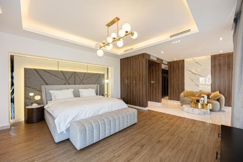 a bedroom with a large bed with a large mirror at Waterfront Villa at Al Hamra with swimming pool in Ras al Khaimah