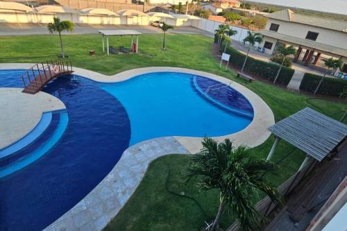Der Swimmingpool an oder in der Nähe von Condomínio Boas vistas