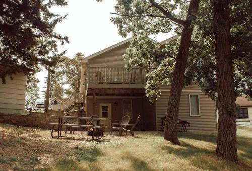 a house with a picnic table in the yard at Easton Hills in Spicer